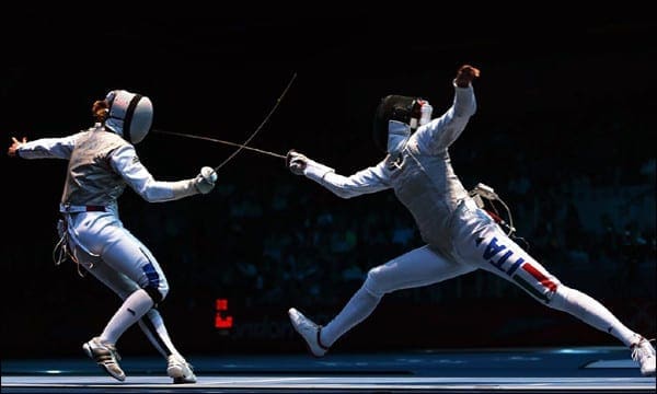 ebay vs.Ticketmaster in the battle over selling paperless tickets Two people fencing - Symbolizes the battle over selling paperless tickets